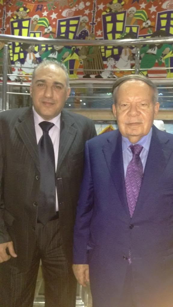 Mazin Kurdi standing with the late Dr. Ahmed Fathi Sorour.